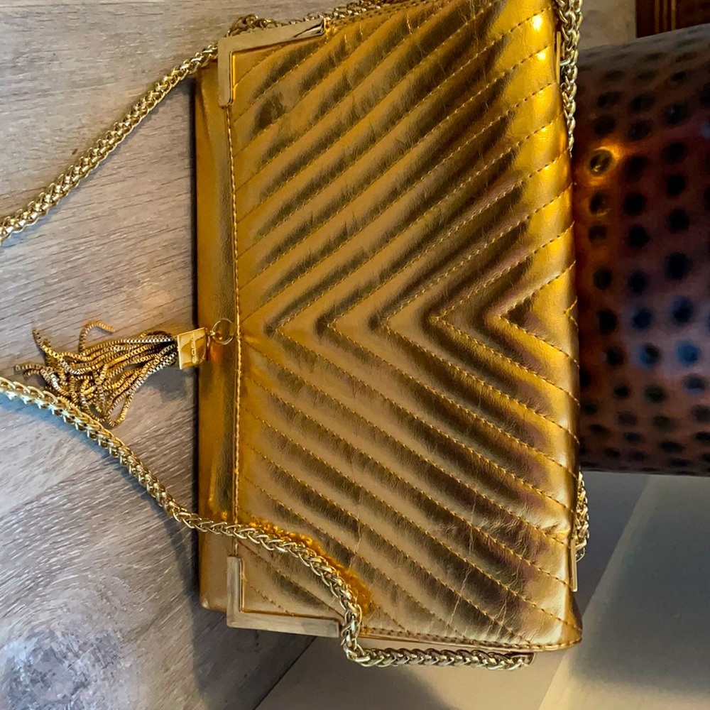 Bebe gold evening bag with metal details